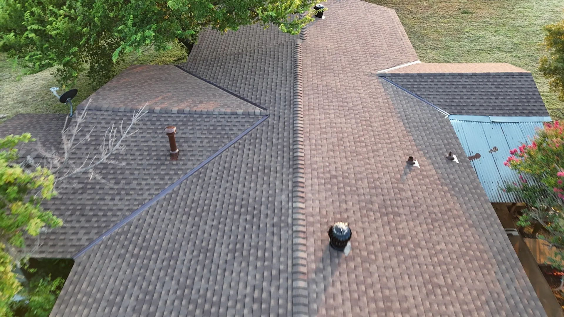 Finished roof with new shingles along the ridge